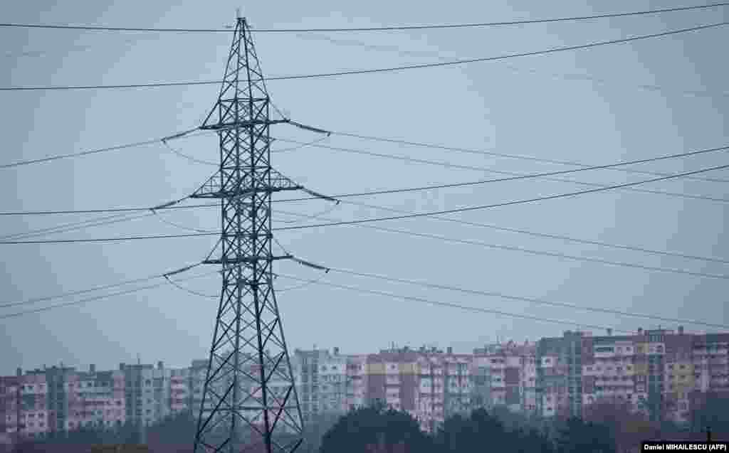 Power lines are pictured on the outskirts of Balti on November 2. Moldova, which has denounced the Kremlin’s invasion of Ukraine, has a contract with Gazprom that fluctuates from month to month based on the spot-market price of gas and oil. With prices soaring and a 40 percent cut in deliveries, the country is struggling to supply enough electricity to its 2.5 million population. 
