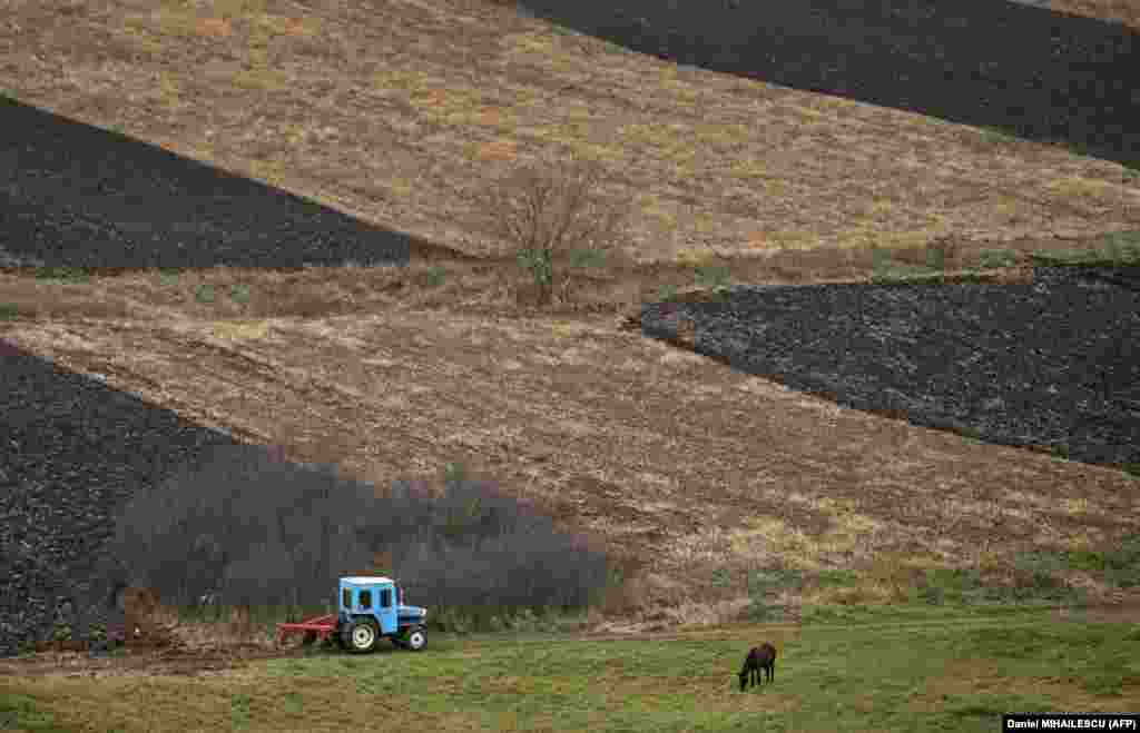 A tractor works the land near Tibirica on November 2. EU member Romania said last month it would start selling electricity to its neighbor at a reduced price because of the difficulties created by the war in Ukraine. The Moldovan government has also urged towns to turn off street lights and households to limit consumption, with businesses asked to alter their hours to work at off-peak times. 
