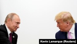 Then-U.S. President Donald Trump (right) and Russian President Vladimir Putin hold a bilateral meeting at the G20 summit in Japan in June 2019.