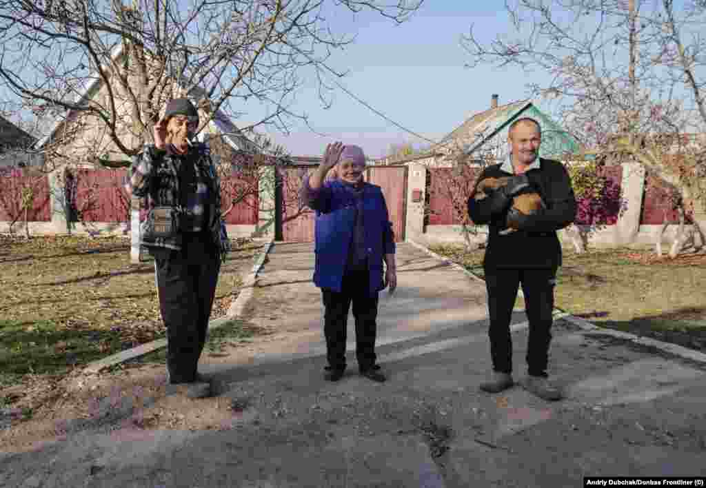 Locals wave as journalists enter the town along with Ukrainian troops. Dubchak told RFE/RL on the evening of November 10 that there was still some fighting taking place in the town, which before the February invasion had a population of around 12,000 people. 