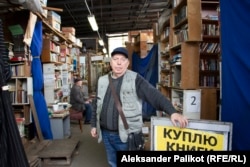 Oleksandr Drobin in his bookshop in Kyiv’s Petrivka book market.