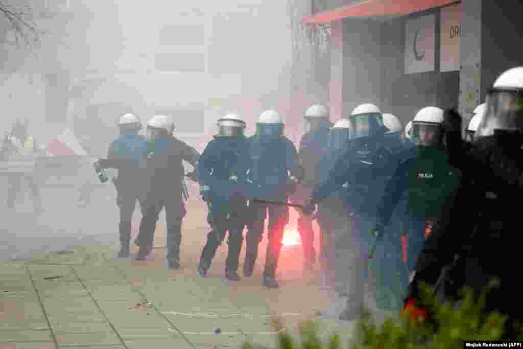 Police seen during the March 6 protest in Warsaw. The European Union says its Green Deal is a part of the bloc's goal to reach "climate neutrality" by 2050, which Brussels says "underpins the EU's position as leading the way in the global fight against climate change." 