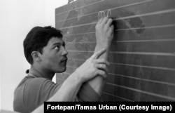 An inmate of the Aszod facility being taught to write in 1975.