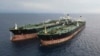 The Iranian-flagged MT Arman 114 (right) and the Cameroon-flagged tanker, MT S Tinos are seen after they were caught conducting an illegal oil transfer near Indonesia. (file photo)