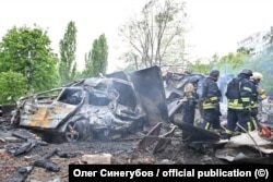Emergency workers examine the aftermath of a Russian strike on a residential building in Kharkiv on May 14.