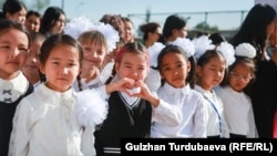 Students arrive for the first day of school in Bishkek on September 1.