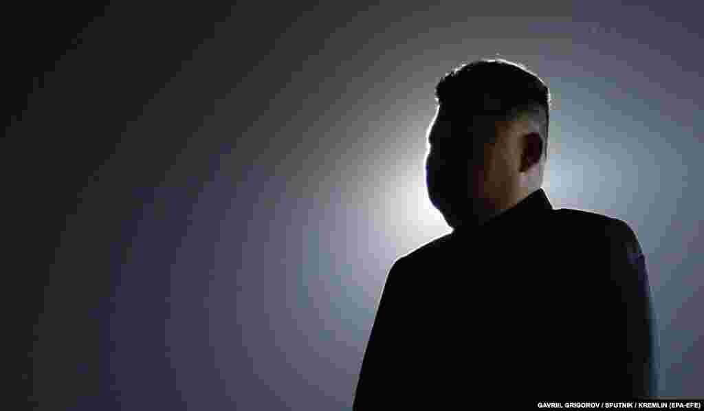 North Korean leader Kim Jong Un waits for the arrival of Russian President Vladimir Putin at the airport in Pyongyang on June 18. The Russian president's two-day visit to the secretive one-party state is being closely watched for signs of a new strategic alliance as Moscow seeks to bolster its supply of munitions and ballistic missiles for use on the Ukrainian battlefield. 