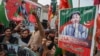 Supporters and activists of the Pakistan Tehrik-e Insaf (PTI) party rally in Peshawar on January 28.
