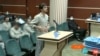Mohammad Mehdi Karami, a client of lawyer Amirhossein Kouhkan, speaks in court in December 2022 before being executed. 