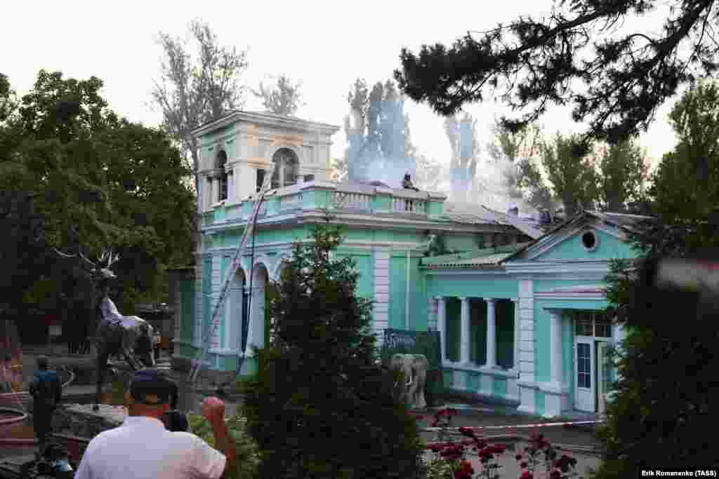 A building of the Rostov-on-Don Zoo smoulders after a fire on June 26. 
