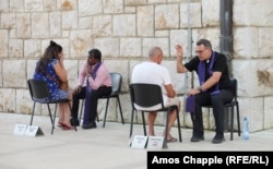 Priests hold open-air confessions in Medjugorje on August 3.