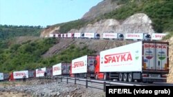 Armenia -- An Armenian convoy of trucks carrying food for Karabakh is stranded near an Azerbaijani checkpoint at the beginning of the Lachin corridor, July 27, 2023.