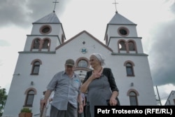 The Karczynskis leave the parish church after attending Sunday Mass.