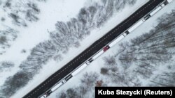 Trucks line up to cross the Polish-Ukrainian border at the Dorohusk-Jagodzin crossing, in Ludwinow, Poland, on December 4.