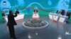 A frustrated Mohammad Fazeli (front left) tore off his microphone and threw it after a heated exchange with a state TV panelist on June 19.