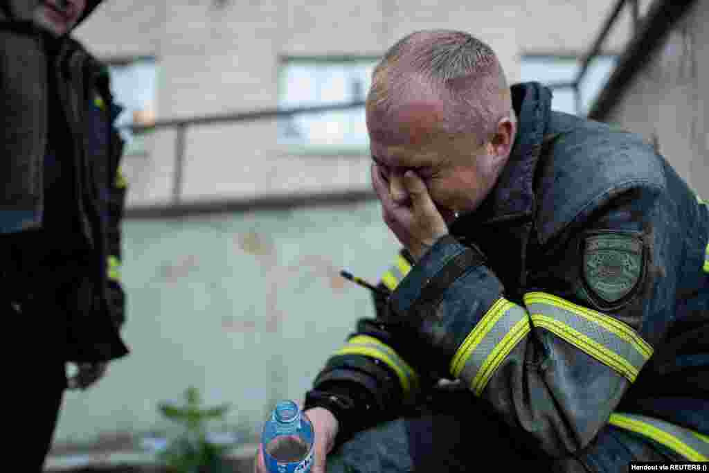 A firefighter reacts on the scene of the drone attack on the apartment building.&nbsp;The attack was the 17th on Kyiv in May. &nbsp;