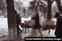 A funeral procession in an Iasi cemetery in January 1988