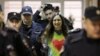 Alexandra (Sasha) Skochilenko, a 33-year-old artist and musician, is escorted inside a court building in St. Petersburg, Russia, on November 16.