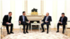 Russian President Vladimir Putin (center right) met with Syrian President Bashar al-Assad (center left) on July 25.