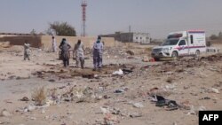 Pakistani security officials examine the site of a deadly bomb attack targeting a procession in Balochistan on September 29. 