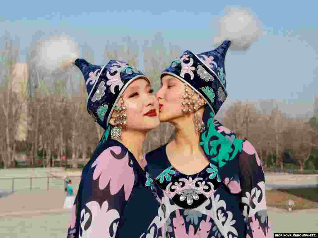 Kyrgyz women wearing traditional costumes celebrate at Ala-Too Square in Bishkek.