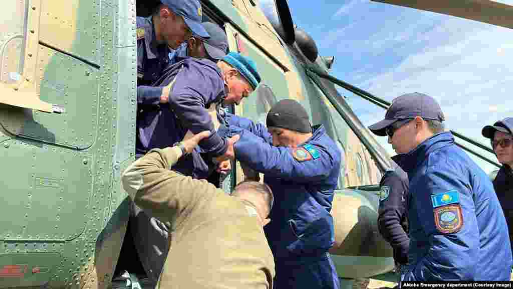 A Kazakh government handout photo shows evacuees being rescued by a military helicopter on April 15. Toqaev assured evacuees that the government would not leave them without assistance. "The state will take care of every citizen, every family. This is my priority," he vowed.