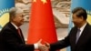 Kazakh President Qasym-Zhomart Toqaev (left) and Chinese President Xi Jingpin (file photo)