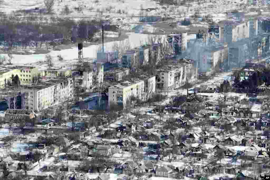 An entire row of apartment blocks have been burned out. Many buildings have only the outer walls left standing.