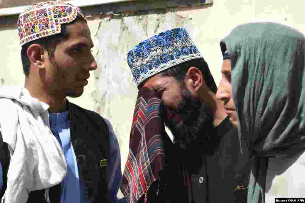 Relatives mourn the death of a loved one at a hospital in Quetta on September 29. &nbsp;
