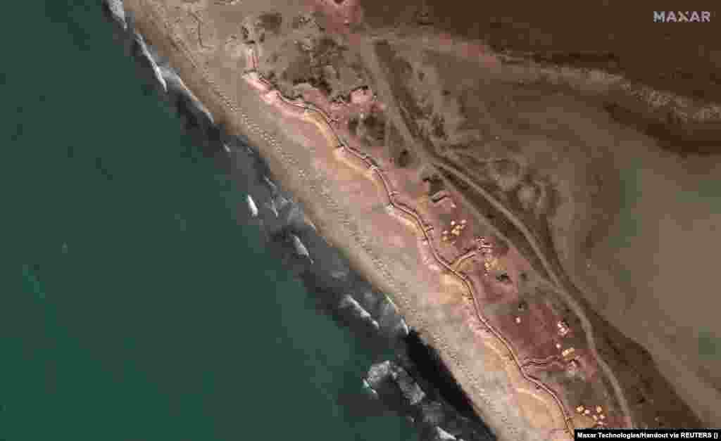 Dragon's teeth and Russian trenches along the beach west of Yevpatoria, southwest Crimea, on March 12. Ukraine would face a formidable challenge to dislodge Russian forces as its troops would likely encounter minefields, anti-tank ditches, and other obstacles. 