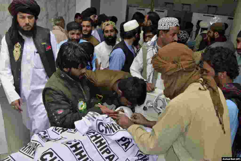 People mourn as they gather around the body of a relative who was killed in the attack during a religious celebration in Balochistan Province. Balochistan, Pakistan&#39;s largest province, borders both Afghanistan and Iran. The region is regularly targeted by Islamist militants, sectarian groups, and nationalist separatists. &nbsp;