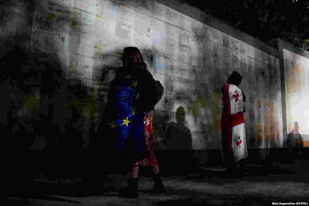 Protesters stop to view the names of fallen soldiers who battled against the Soviet Army in the 1920s, the Abkhaz war in 1992-93, and in the August 2008 Russo-Georgian War at Heroes' Square. One of the organizers told RFE/RL that a large protest against the "foreign agent" bill is currently being planned for May 11.