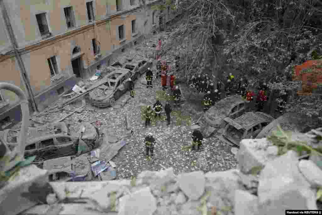 Rescue workers continue to search the residential area, looking for survivors.