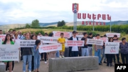Nagorno-Karabakh - Activists block a road from Stepanakert to Aghdam offered by Azerbaijan as an alternative supply line to Karabakh and demand the reopening of the Lachin corridor, July 18, 2023. 