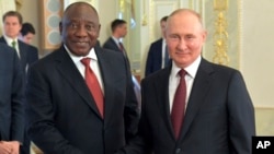 Russian President Vladimir Putin (right) meets with his South African counterpart, Cyril Ramaphosa, in St. Petersburg last month. 