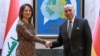 Iraqi Foreign Minister Fuad Hussein (right) receives his German counterpart, Annalena Baerbock, at the Foreign Ministry in Baghdad on March 7.