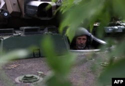 A Ukrainian marine infantryman from the 37th Brigade looks through the hatch of a French-made AMX-10 RC armored fighting vehicle at a position in the Donetsk region. (file photo)