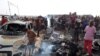Palestinians gather at the site of an Israeli strike on a camp for internally displaced people in Rafah on May 27.