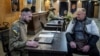 A volunteer hoping to join Ukraine's 3rd Separate Assault Brigade talks to a recruitment officer. (file photo)