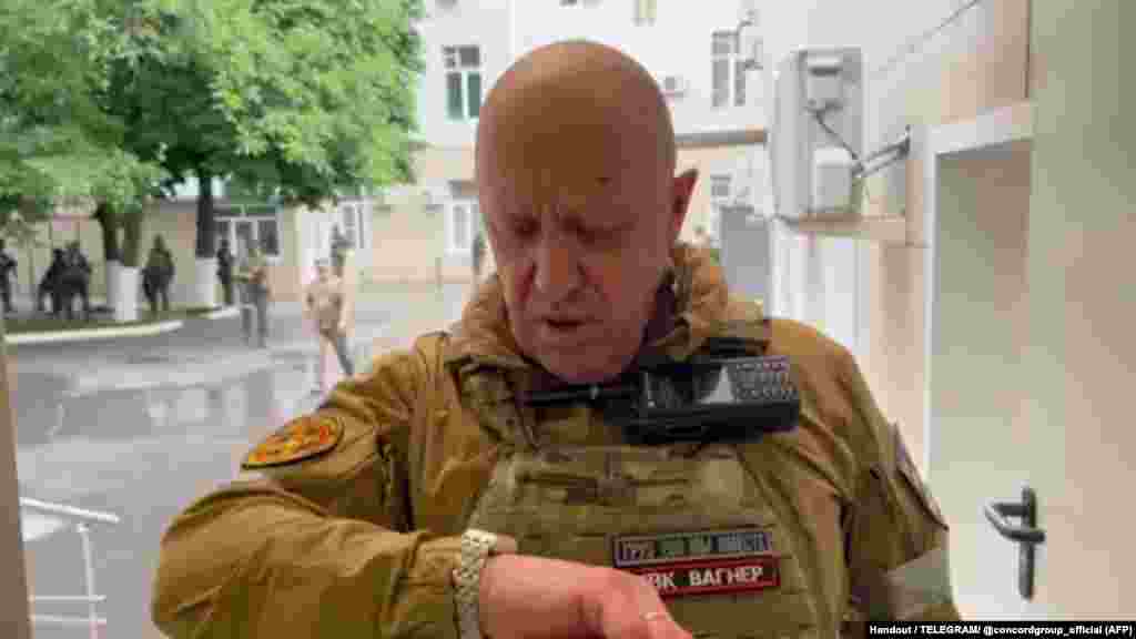 A video grab purporting to show Prigozhin inside the headquarters of the Russian southern military district on June 24. Prigozhin claimed on June 23 that a Wagner camp in Ukraine had been hit “from the rear” by a missile and accused the Russian military of carrying out the strike.