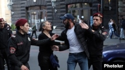 Armenian police arrest protesters trying to block the streets of Yerevan on May 13. 