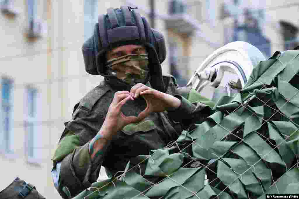 A man reportedly belonging to Wagner gestures to a photographer on the morning of June 24. Russia’s Defense Ministry called the "strike" claim a provocation, and some pro-Kremlin figures claimed the video showing the alleged aftermath was staged. 