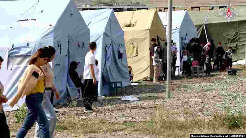 An image released by the Russian Defense Ministry on September 21 reportedly shows civilians evacuated by Russian peacekeepers at an undisclosed location. Azerbaijan halted its military action in the breakaway region of Nagorno-Karabakh on September 20 after its swift battlefield success forced Armenian separatists to agree to a cease-fire that would see the area fully return to Baku's control.