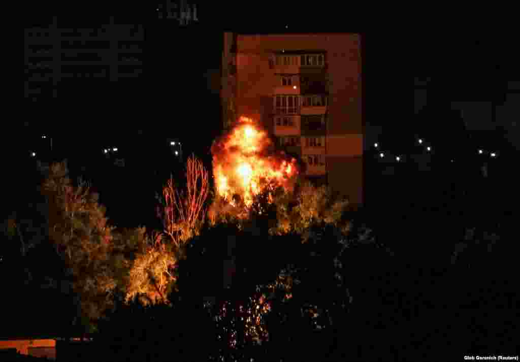 A Russian drone explodes as it strikes a building in Kyiv early on July 13. At least one person died and several were injured in an overnight Russian drone attack on Ukraine's capital, authorities said.