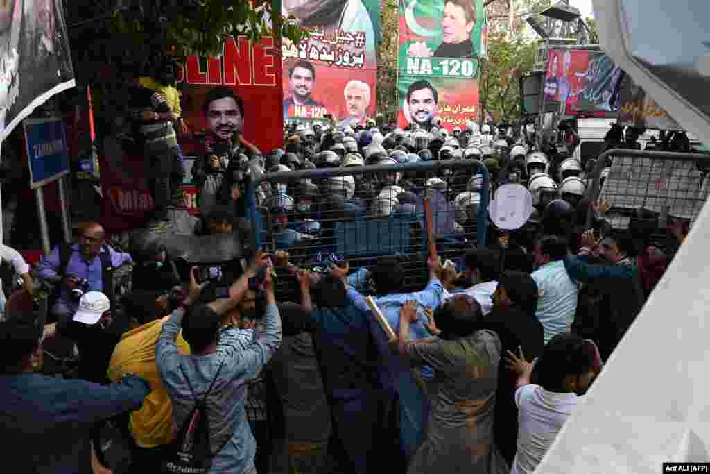 Supporters of the former prime minister fought off riot police as they tried to enter the compound. Khan is accused of selling official gifts received from foreign dignitaries without authorization and failing to disclose them as assets to the electoral commission. 