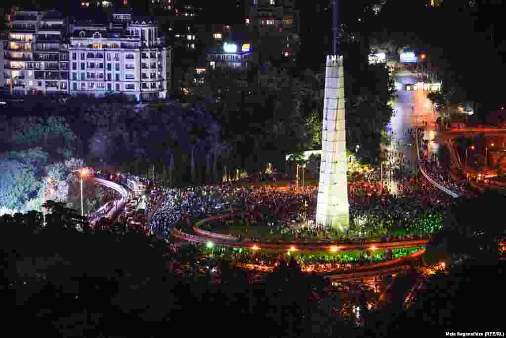 Peaceful protesters surround the monument on Heroes' Square. The May 1 demonstration -- one of the largest the country has ever seen -- took place after the bill advanced in a second-reading vote. 