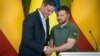 Spanish Prime Minister Pedro Sanchez (left) meets with Ukrainian President Volodymyr Zelenskiy in Kyiv on July 1. 