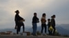 Residents of the village of Kornidzor give food to refugees from Nagorno-Karabakh