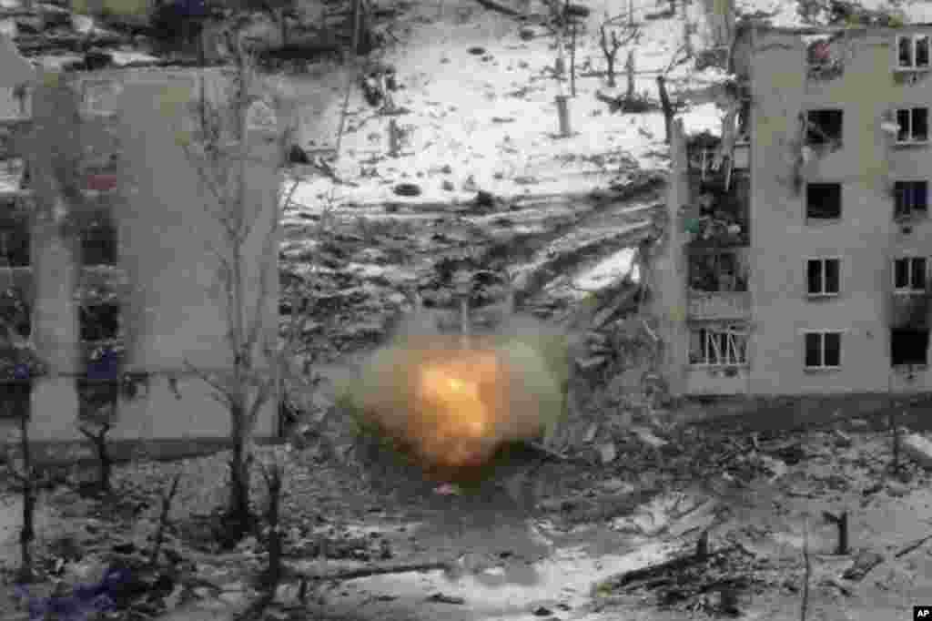 A Russian tank fires at Ukrainian positions in Maryinka. The police chief, Artem Schus, describes his town as “completely destroyed.”