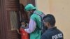 An official (center) from the Pakistan Bureau of Statistics goes door-to-door as part of the first-ever digital national census in Pakistan, in Karachi on March 1. 